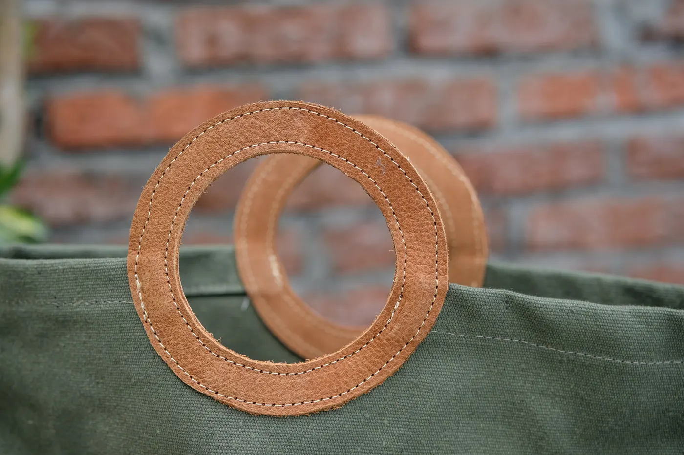 Close-up of hand-stitched leather O-handle