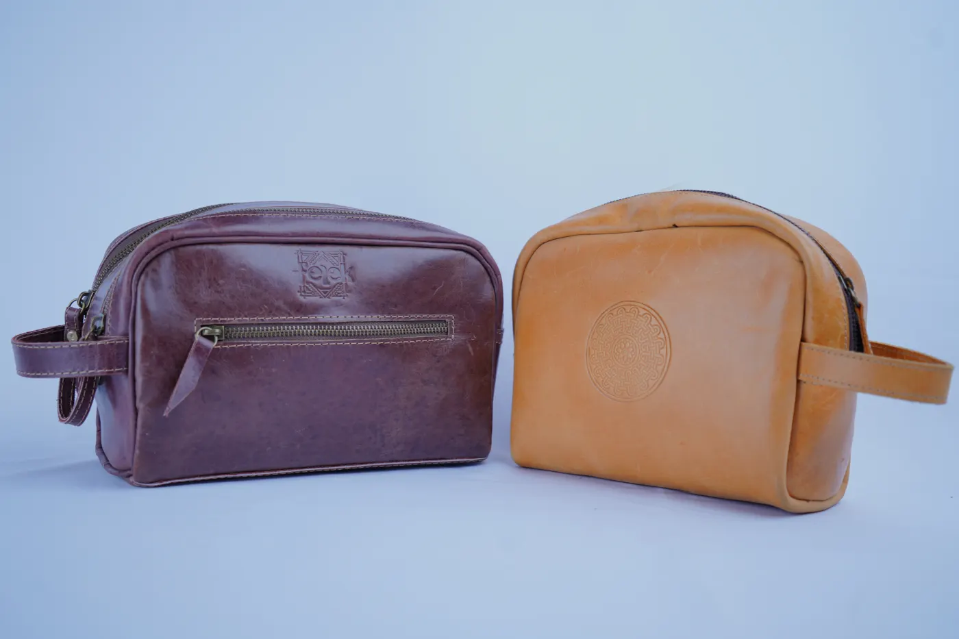 Two leather travel pouches