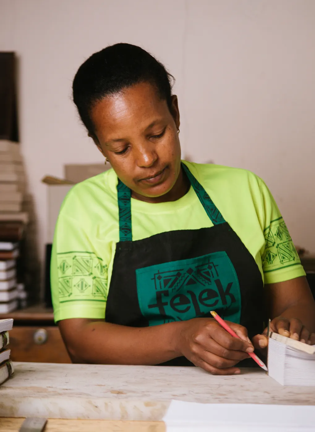 Craftswoman preparing journal pages